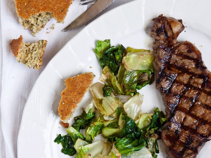 Strip Steak with Wilted Escarole and Cornbread